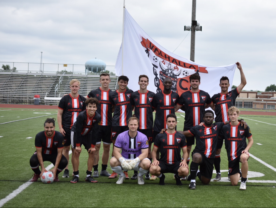 Valhalla FC with the club flag on the pitch